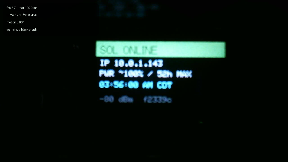 Second C615 camera crop showing the T-Dongle status clock at a later second